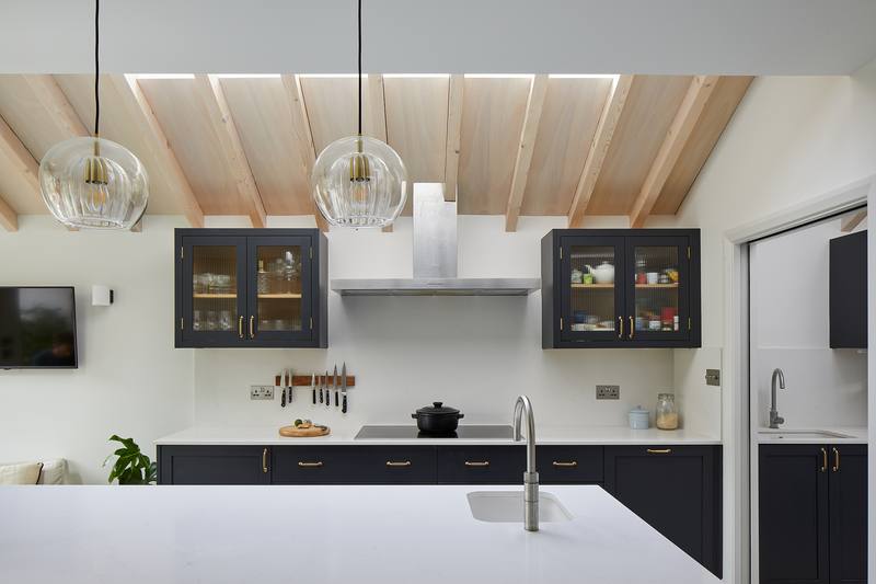Black cabinets & timber roof